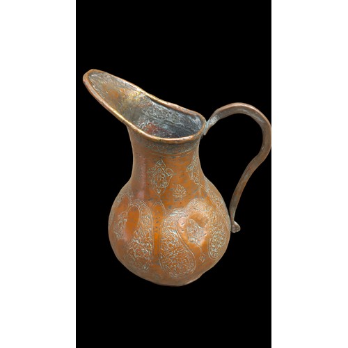 475 - AN ANTIQUE COPPEER JUG 11