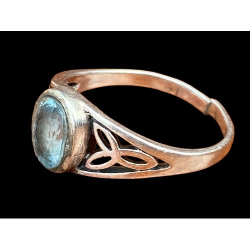 502 - A CELTIC BLUE TOPAZ SILVER RING (HAS BEEN CUT)