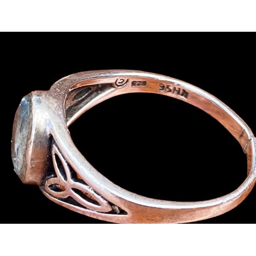 502 - A CELTIC BLUE TOPAZ SILVER RING (HAS BEEN CUT)