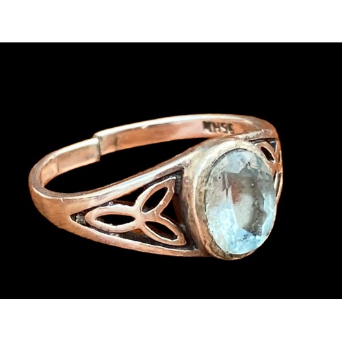 502 - A CELTIC BLUE TOPAZ SILVER RING (HAS BEEN CUT)