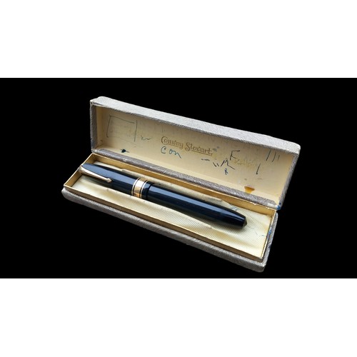 591 - A CONWAY STEAWART FOUNTAIN PEN WITH A 14CT GOLD NIB IN ORIGIANL BOX