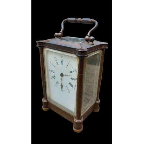 522 - AN ANTIQUE BRASS  CARRIAGE CLOCK WITH 5 GLASS PANELS