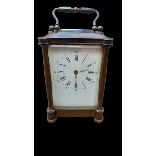 522 - AN ANTIQUE BRASS  CARRIAGE CLOCK WITH 5 GLASS PANELS