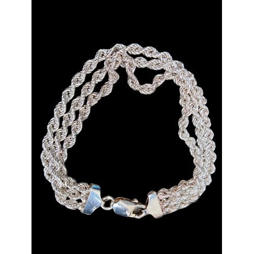 532 - A SILVER TRIPLE ROPE BRACELET