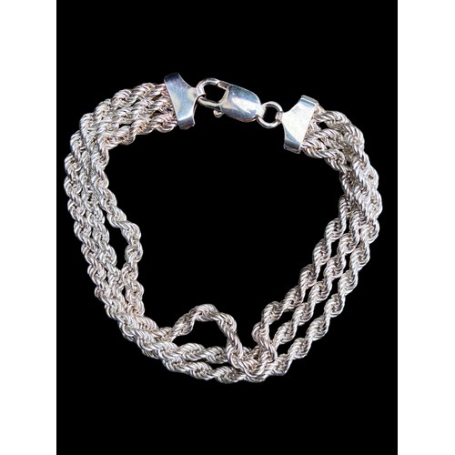 532 - A SILVER TRIPLE ROPE BRACELET