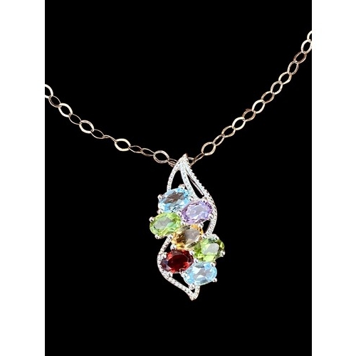 534 - A MULTI GEM SET SILVER DESIGNER PENDANT ON SILVER CHAIN