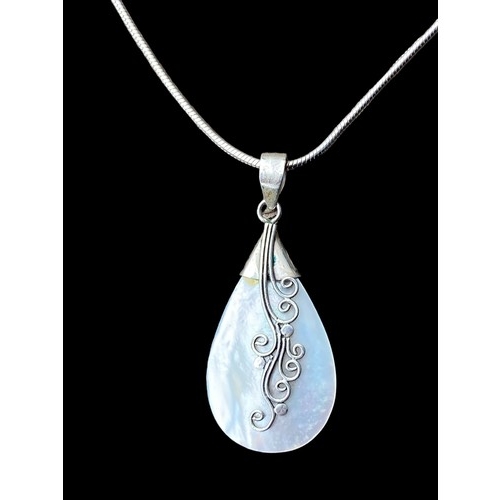 543 - AN ORNATE SILVER & M.O.P PENDANT ON A SILVER SNAKE CHAIN