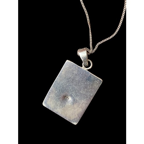 550 - A LARGE SILVER AND M.O.P PENDANT ON SILVER CHAIN