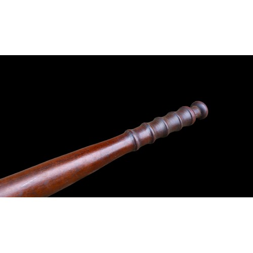 575 - AN OLD POLICE (PROBABLY R.U.C) TRUNCHEON IN MAHOGANY 15”