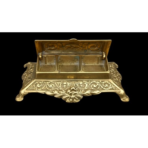 576 - AN ORNATE HEAVY BRASS DESK TIDY