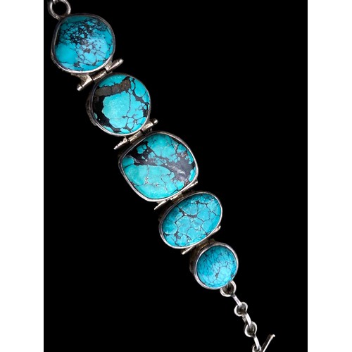 530 - A HEAVY SILVER BRACELET SET WITH LARGE TURQUOISE STONES