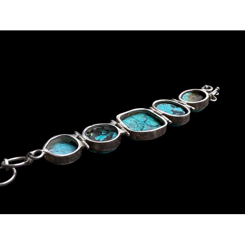 530 - A HEAVY SILVER BRACELET SET WITH LARGE TURQUOISE STONES