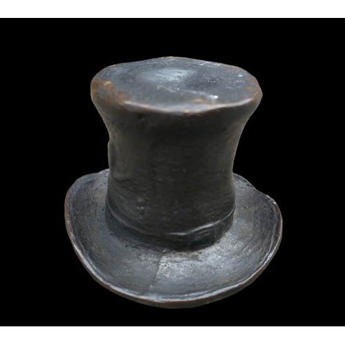 557 - A MINITURE BRONZE TOP HAT