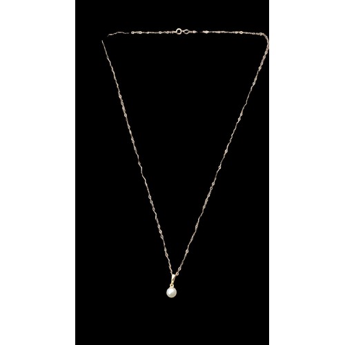 600 - 9ct PEARL PENDANT ON A 9ct CHAIN