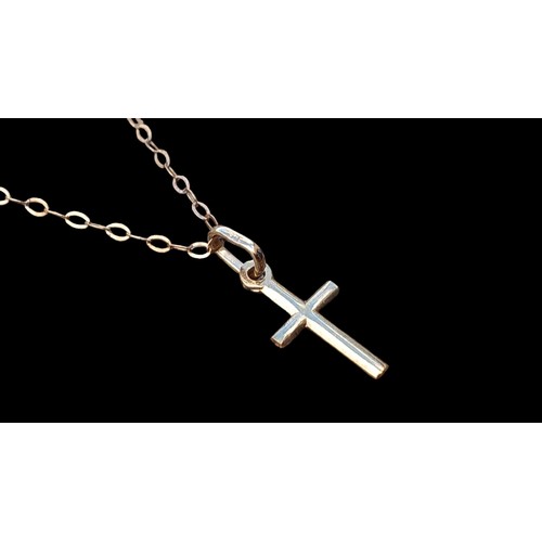 605 - A FINE 9ct GOLD CROSS AND CHAIN