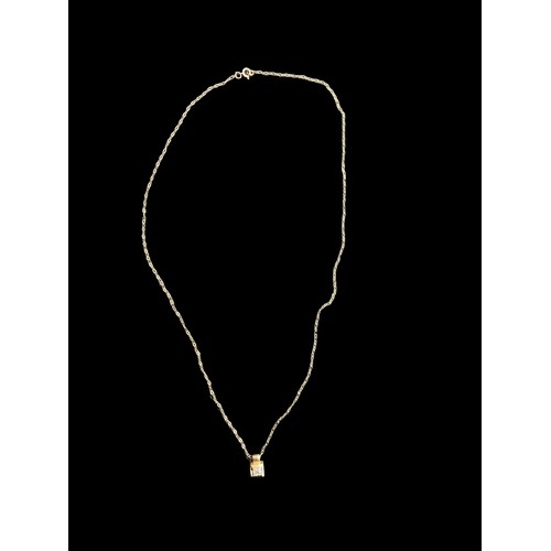 625 - A 9ct GOLD PENDANT SET WITH SQUARE CUT STONE ON A 9ct CHAIN