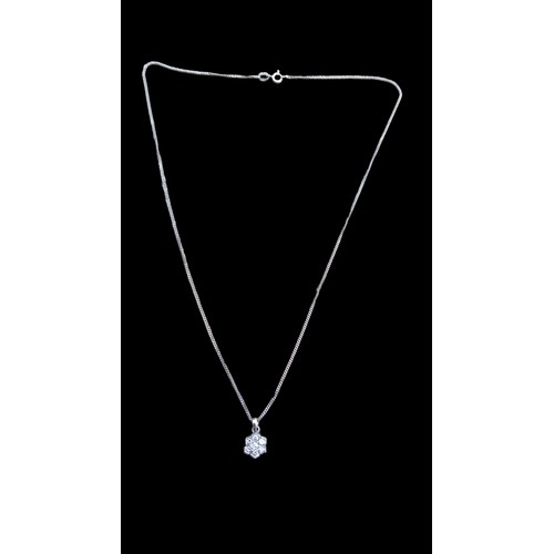 671 - AN 18CT WHITE GOLD DIAMOND PENDANT ON AN 18CT WHITE GOLD CHAIN