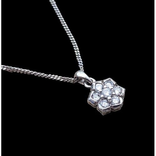 671 - AN 18CT WHITE GOLD DIAMOND PENDANT ON AN 18CT WHITE GOLD CHAIN