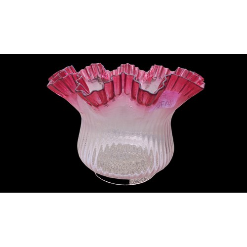 676 - AN ANTIQUE RUBY TIP FRILLED AND RIBBED OIL LAMP SHADE