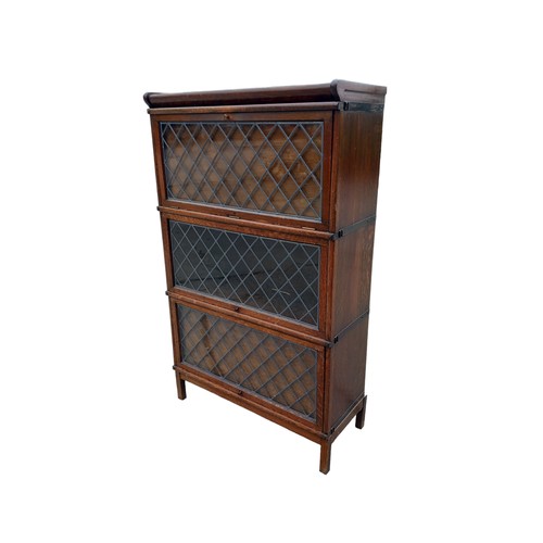 684 - A 3 TIER OAK STACKING BOOKCASE WITH LEADED GLASS 34x56x15