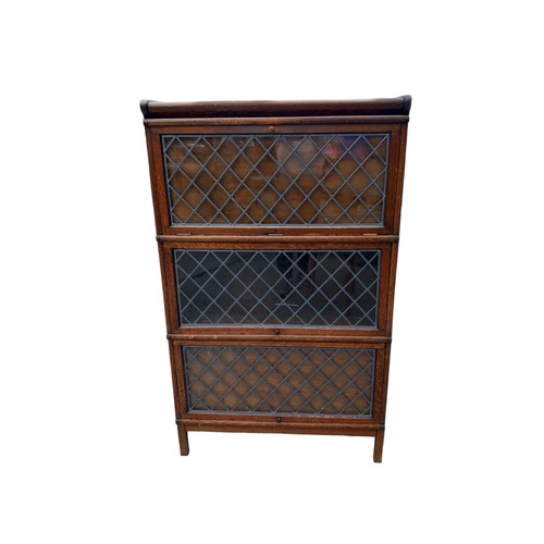 684 - A 3 TIER OAK STACKING BOOKCASE WITH LEADED GLASS 34x56x15