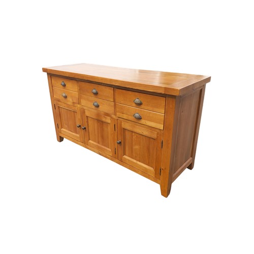 700 - A QUALITY LIGHT OAK SIDEBOARD  WITH 3 DRAWERS OVER 3 DRAWERS WITH ANTIQUED BRASS HANDLES MEASURES  6... 