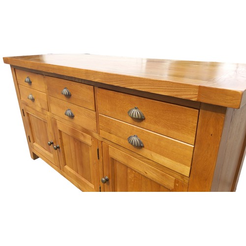 700 - A QUALITY LIGHT OAK SIDEBOARD  WITH 3 DRAWERS OVER 3 DRAWERS WITH ANTIQUED BRASS HANDLES MEASURES  6... 