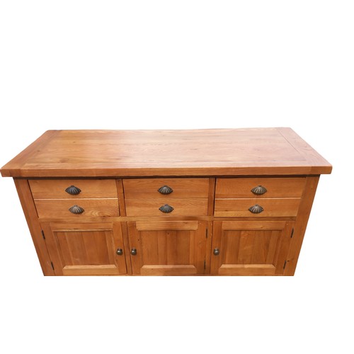 700 - A QUALITY LIGHT OAK SIDEBOARD  WITH 3 DRAWERS OVER 3 DRAWERS WITH ANTIQUED BRASS HANDLES MEASURES  6... 