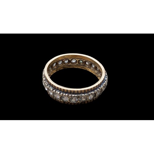 583 - 12ct GOLD AND DIAMOND ETERNITY RING