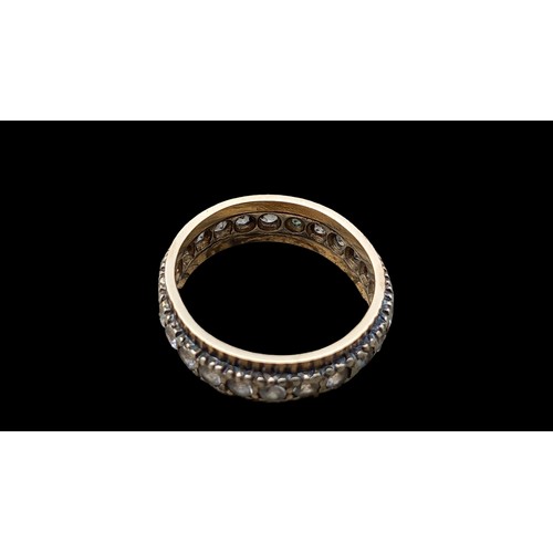 583 - 12ct GOLD AND DIAMOND ETERNITY RING