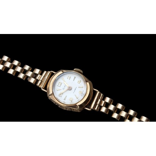 601 - A 9CT GOLD WATCH ON A 10th 12ct ROLLED GOLD STRAP