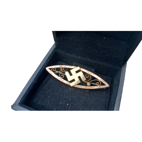 601A - A 9CT GOLD SWASTIKA