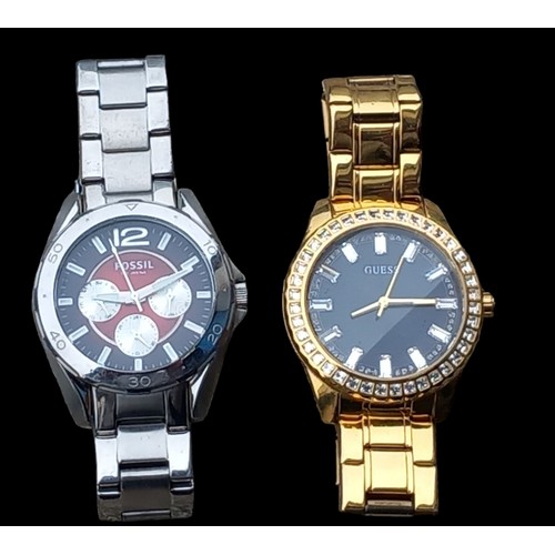 222 - A FOSSIL WATCH & A GOLD PLATED GUESS WATCH