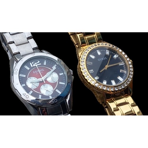 222 - A FOSSIL WATCH & A GOLD PLATED GUESS WATCH