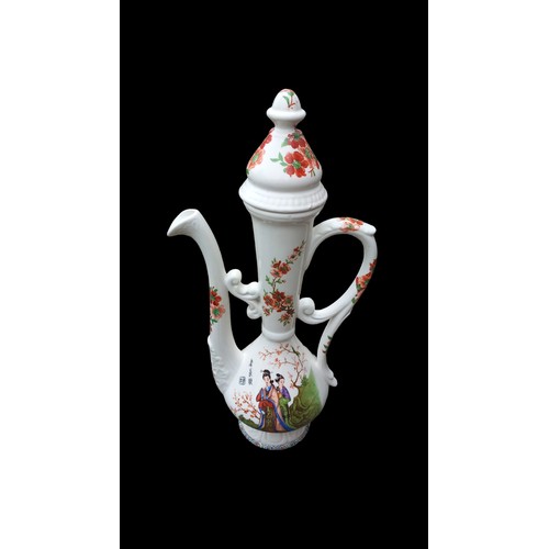 67 - A LARGE ORIENTAL TEAPOT WITH MARKINGS 20