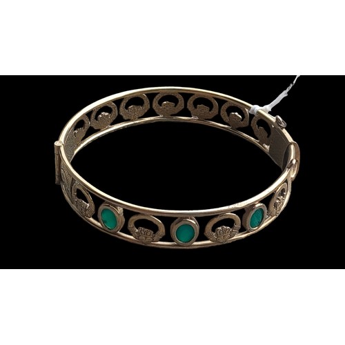 177 - 18CT GOLD PLATED CELTIC BANGLE SET WITH A GREEN STONE