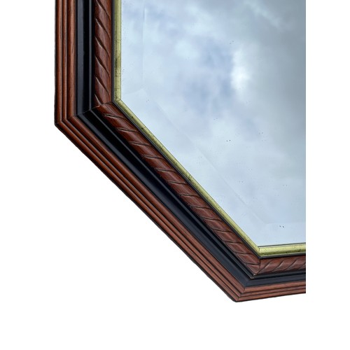 57 - A SHAPED MAHOGANY ROPE EDGE BEVELLED MIRROR