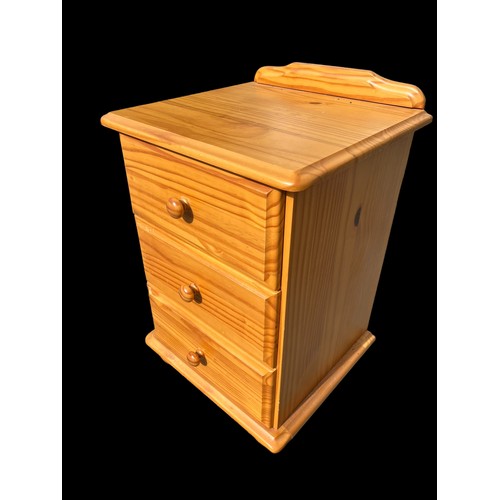 100 - A PINE 3 DRAWERED BEDSIDE