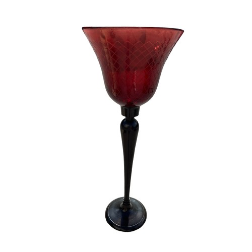 104 - A BRONZE FINISH CANDLE STAND WITH RED GLASS HOLDER 30