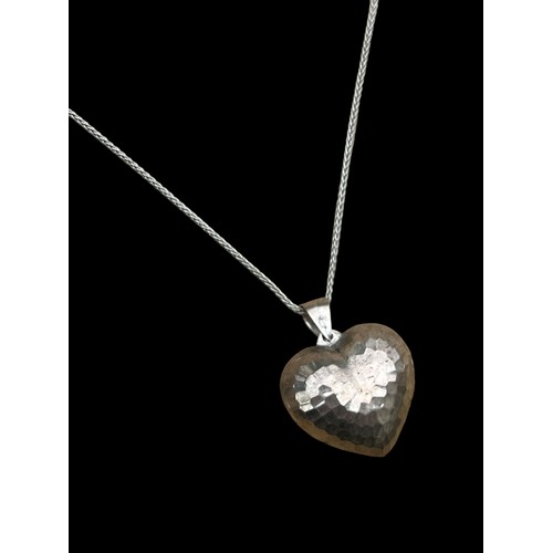 195 - A LARGE SILVER HEART FOB ON SILVER CHAIN