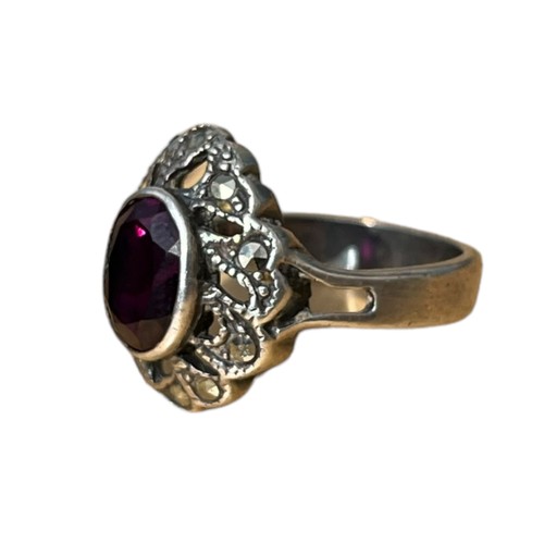 228 - A SILVER AMETHYST AND MARCASITE RING