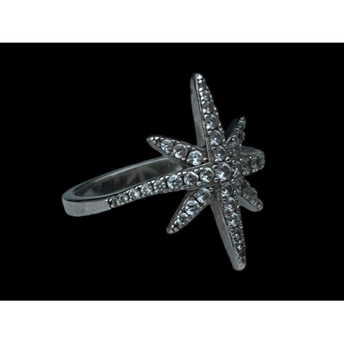 229 - A SILVER GEM SET STAR RING