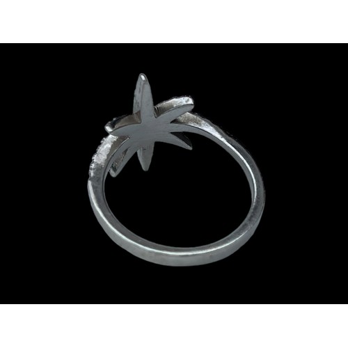 229 - A SILVER GEM SET STAR RING