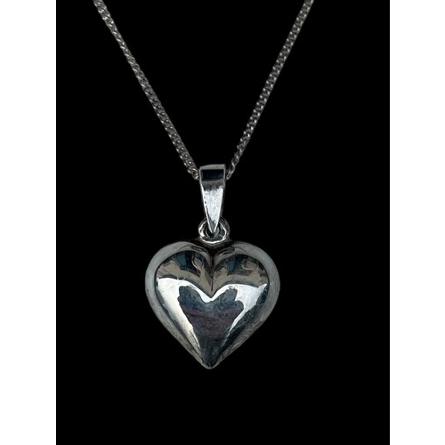 242 - A SILVER HEART PENDANT ON A SILVER CHAIN