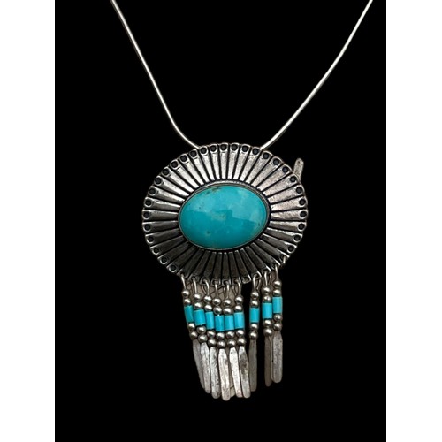 258 - A SILVER AND TURQUOISE PENDANT ON SILVER CHAIN