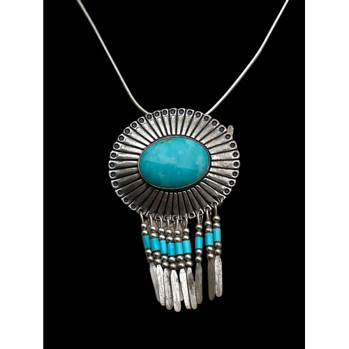 258 - A SILVER AND TURQUOISE PENDANT ON SILVER CHAIN