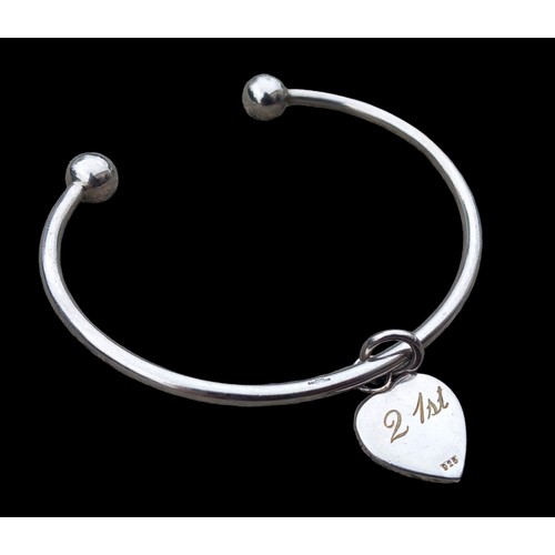 277 - A SILVER BANGLE WITH 21ST FOB 18G