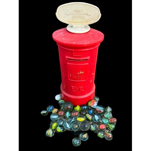 311 - A POST BOX MONEY BOX WITH MARBLES