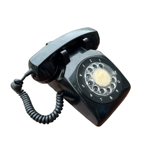 323 - AN OLD BLACK BAKELITE PHONE