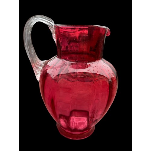 333 - 2 VERY NICELY SHAPED RUBY GLASS JUGS WITH CLEAR GLASS HANDLES